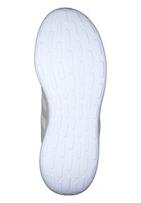 Semelle de chaussure en caoutchouc blanc avec un motif de grip texturé en forme d'ovale, révélant partiellement le tissu beige de la tige sur le côté.