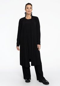 YOEK MIT DRUCK - Vest - black