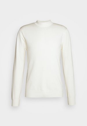 Džemper s okruglim izrezom od mekog, slonovače pletenog materijala. Ima dugačke rukave, rebraste manžete i prilagođeni kroj. Minimalistički dizajn bez uzoraka.