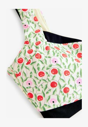 Virágmintás bikini felsőrész, cseresznye és virágok piros, zöld és rózsaszín dizájnjával. Az alján egyszínű fekete szalag. Sima anyagú kivitel.