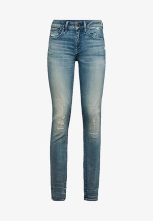 Strakke jeans in lichtblauw denim met versleten details, waaronder meerdere scheuren. Voorzien van klassieke vijfzakkenontwerp en knoopsluiting.