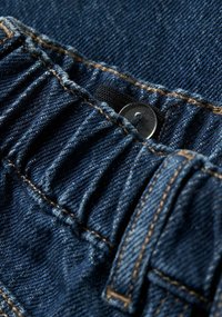 Dark blue denim fabric with gathered texture. Features a metallic button and contrasting yellow stitching along the edges.
