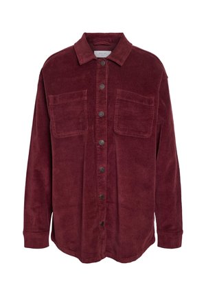 Burgunderfarget corduroy-skjorte med krage, frontknapplukking, to brystlommer og ribbet tekstur. Lange ermer med knappeermet.