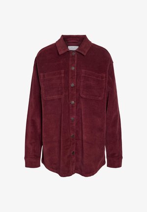 Burgundy corduroy shirt with a collar, front button closure, two chest pockets, and ribbed texture. Long sleeves with buttoned cuffs.