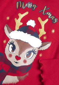 Felpa rossa con un renna che indossa un cappello a quadri, corna dorate e la scritta "Buon Natale". Decorata con motivi di fiocchi di neve bianchi.