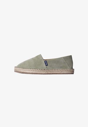 Light green suede espadrille with woven jute sole and side fabric tag, shown in profile on white background.
