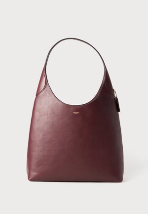 Burgundy leather shoulder bag with a rounded top, smooth texture, and a single strap. Features subtle stitching and a logo detail.