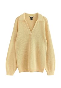 Lys gul strikket sweater med V-udskæring, oversized pasform, lange ærmer og flad strikketekstur. Har en klassisk krave og ribbet nederkant.