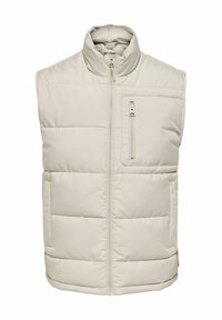 Beige polstret vest med høj krave, frontlynlås og en lynlåslomme på brystet. Lavet af glat, letvægts syntetisk materiale.