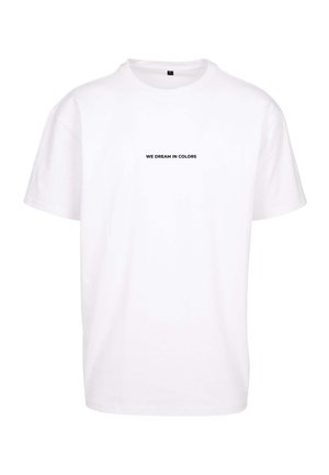 T-shirt bianco in cotone a maniche corte, con la scritta nera "WE DREAM IN COLORS" stampata al centro davanti. Design con collo rotondo.