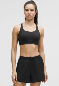 ENERGY EVOLVE - Medium support sports bra - black