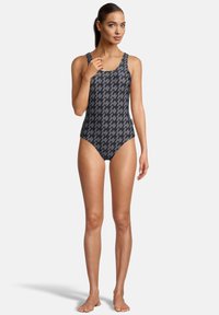 Maillot de bain une pièce en gris foncé avec un motif pied-de-poule, doté de larges bretelles et d'un design ajusté. Tissu lisse et extensible.