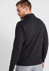 Calvin Klein Golf NEWPORT HALF ZIP - Ilgarankovis viršutinės dalies drabužis - black