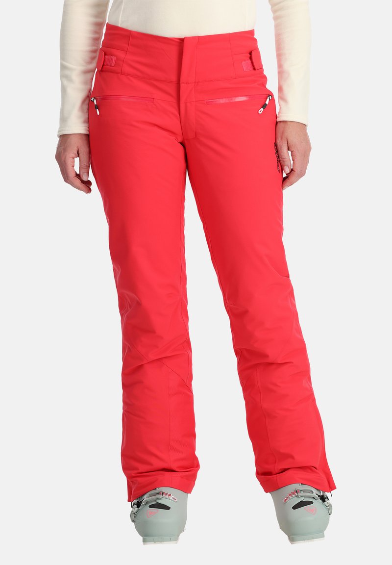 Rote Skihosen haben ein elegantes Design mit Reißverschlusstaschen, strukturiertem Stoff und einer engen Passform. Der Saum hat eine leichte Weite, ideal für Skischuhe.