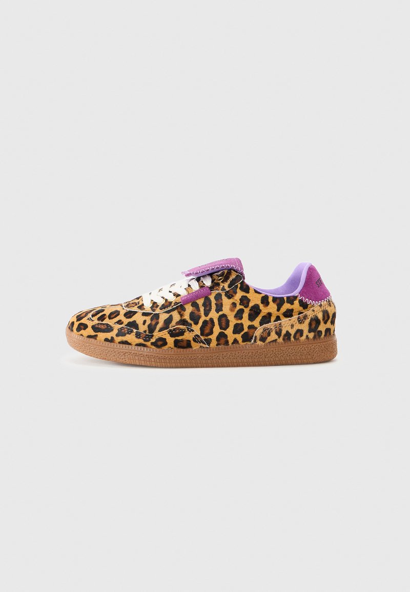 Leopard print sneakers with a tan rubber sole, white laces, and purple accents at the tongue and heel. Smooth fabric with a textured finish.