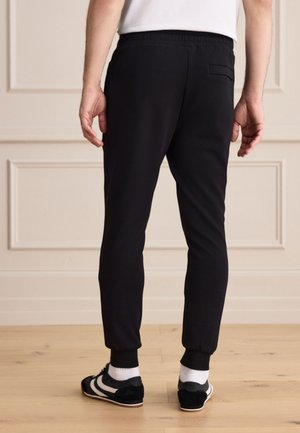 Next, REGULAR FIT - SIGNATURE SOFT TOUCH  - Jogginghose - black