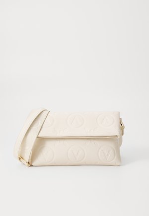 Cream-colored fold-over clutch bag with adjustable strap and embossed circular logo pattern on textured surface.