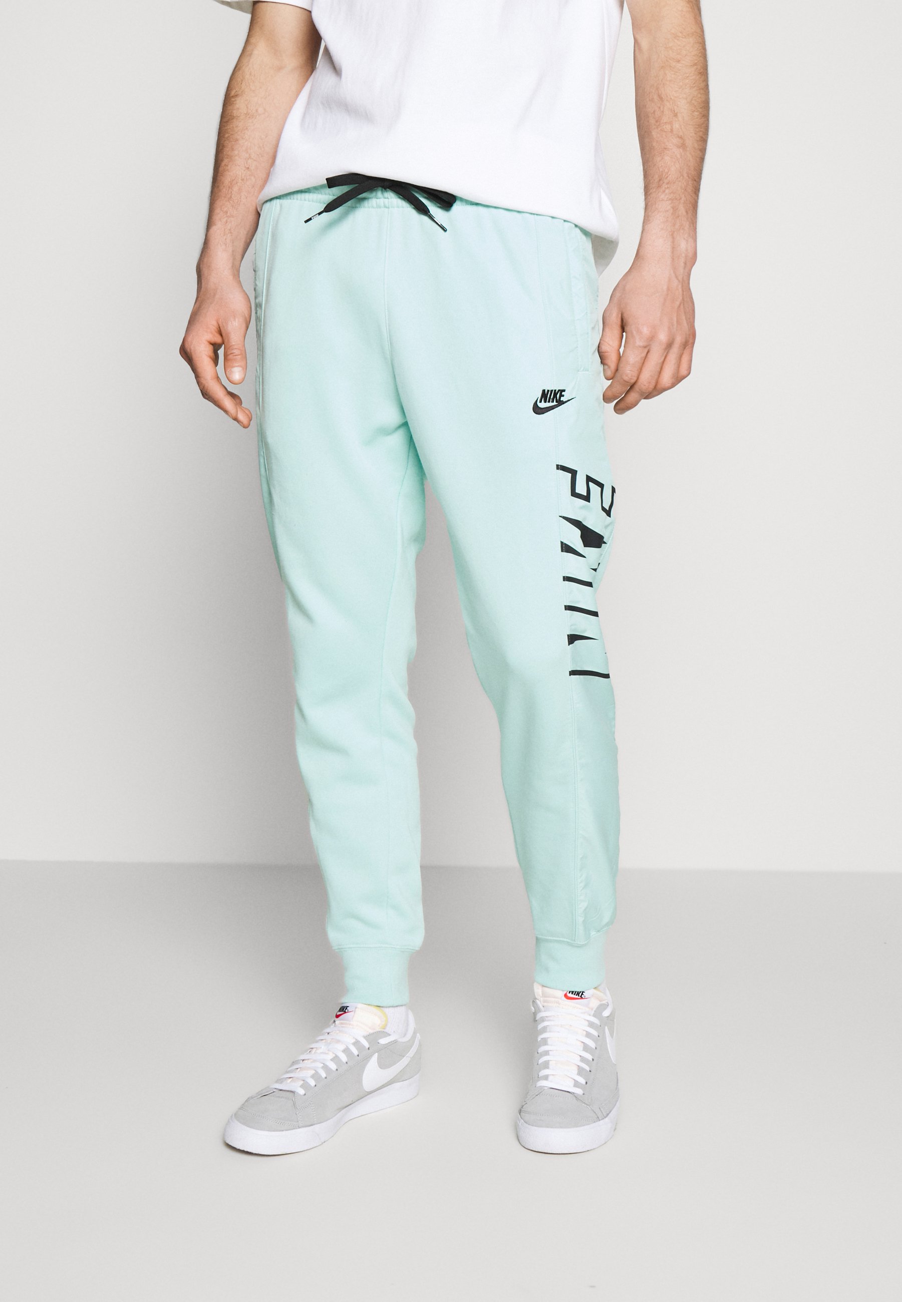Nike Sportswear Pantalon de survêtement - light dew/black/menthe - ZALANDO .FR