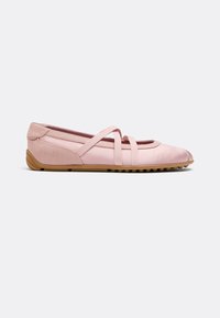 Light pink ballet flat shoe with crisscross elastic straps and a brown rubber sole with textured grip, shown from the side on a white background.