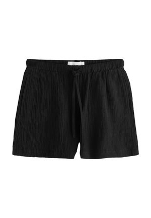 Melni teksturēti auduma šorti ar elastīgu vidukļa joslu, aukliņu un sānu kabatām, izklāti uz balta fona.