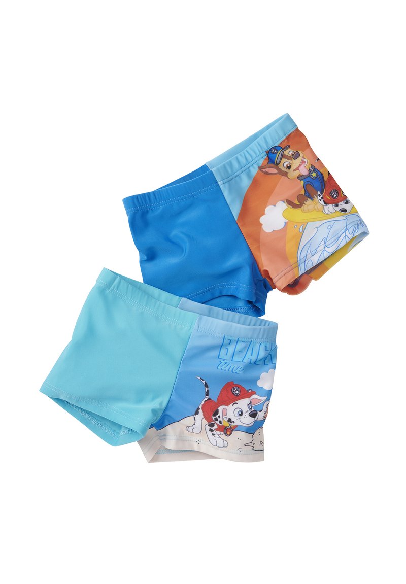 Pantaloni da mare blu con un mix di design solidi e a motivi. Un lato presenta personaggi su uno sfondo arancione, mentre l'altro ha una base blu con illustrazioni.