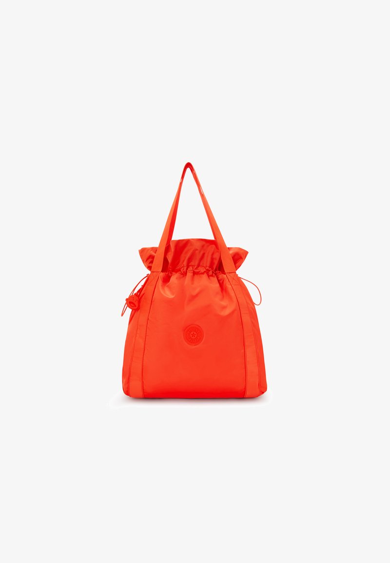 Orange nylon drawstring bag with contrasting shoulder straps and a circular logo on the front. Smooth texture and rounded silhouette.