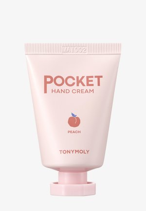 Kompakt lyserød tube af TonyMoly Pocket Hand Cream med ferskensduft, med et orange ferskenikon og en lyserød skruelåg.