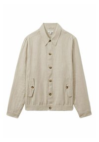 Chaqueta de lino color beige claro con cuello tipo solapa, cierre frontal de botones, dos bolsillos laterales y dobladillo elástico. Presenta botones de madera.