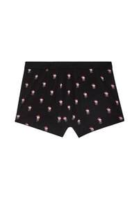 Sorte boxer shorts lavet af bomuld med et gentaget mønster af små kranier iført røde nissehuer. Elastisk talje, ingen yderligere detaljer.