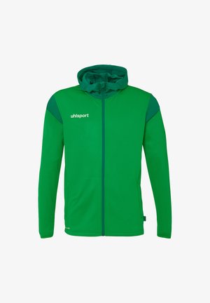 Groene hooded jack met ritssluiting, gemaakt van gladde stof, met donkerdere groene accenten op de schouders en de tekst "uhlsport" in het wit.