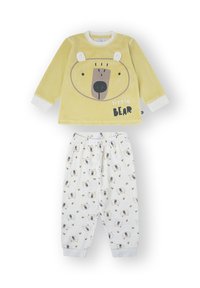 Parte superior de pijama amarilla con diseño de cara de oso; pantalones blancos a juego con patrón de pequeñas caras de oso y abejas; tejido suave, corte cómodo.