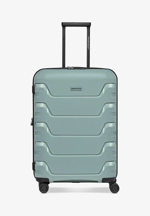 Hartschaliger mintgrüner Koffer mit vier Rädern, ausziehbarem schwarzem Griff und horizontal geriffeltem Design, beschriftet mit "SMARTBOX".