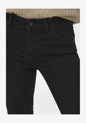 Zwarte spijkerbroek van denim met een aansluitend ontwerp, vijf zakken en metalen knoopsluiting. De stof heeft een gladde textuur met een lichte stretch.