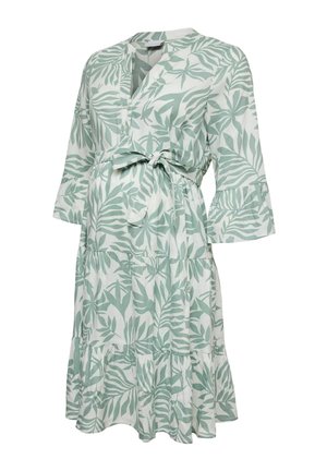 Weißes knielanges Kleid mit grünem Blattmuster, V-Ausschnitt, dreiviertel langen, mit Rüschen verzierten Ärmeln und einem gebundenen Taillengürtel.