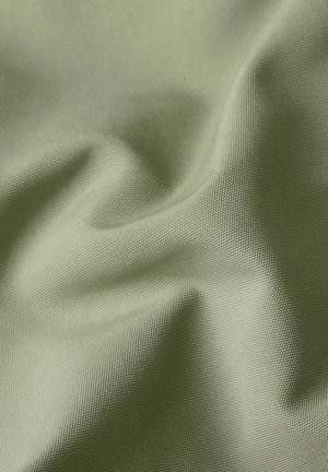 Lichtgroene stof met een strakke weving, met zachte plooien en een gestructureerd oppervlak.