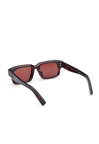 Rectangular sunglasses with a dark tortoiseshell frame, red tinted lenses, and solid black arms featuring subtle textured accents.
