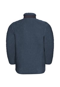Veste en polaire bleu marine avec une surface douce et texturée. Elle possède un col haut et une coupe droite, ample avec des bords arrondis.