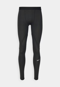 Svarta sportiga leggings med en tajt passform, med texturerade accenter och en logotyp nära fållen. Slät material och elastisk midjeband.