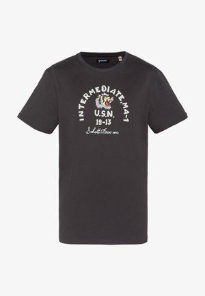 T-shirt noir à manches courtes avec un graphisme de tête de tigre et un texte blanc sur le devant indiquant "INTERMEDIATE MA-1 U.S.N. 19-13 Schott Bros mc".
