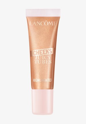 Enlumineur Lancôme Cheeks Juicy Tubes dans un tube brillant rose gold avec un bouchon rose pâle sur fond blanc.