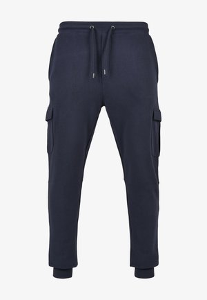Granatowe spodnie dresowe z elastycznym pasem, sznurkiem do wiązania, bocznymi kieszeniami cargo z klapkami oraz ściągaczami przy kostkach.