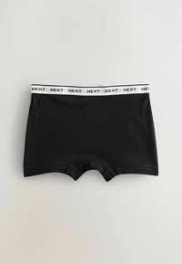 Boxer shorts en coton noir avec une ceinture élastique blanche portant la marque "NEXT". Texture lisse avec un design classique et ajusté, et ouvertures de jambe arrondies.