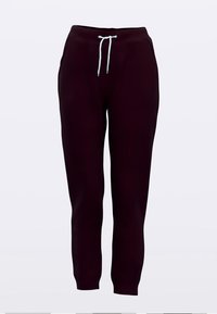 Burgundi värvi dressipüksid kitsenevate säärega, millel on helerohelise tooniga nöör ja pehme, tekstuuriga kangas. Paistvate taskuteta.