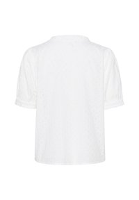 Blusa bianca a maniche corte con texture a foro, colletto rotondo e maniche arricciate. La parte posteriore presenta un sottile motivo ricamato.