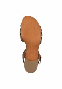Brune lædersandal med en glat, struktureret sål. Har en solid hæl og justerbare stropper for en sikker pasform.
