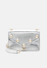 Silver faux leather handbag with gold pyramid studs, envelope design, and detachable strap. Smooth texture with creased finish.