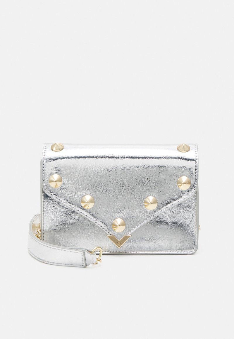 Silver faux leather handbag with gold pyramid studs, envelope design, and detachable strap. Smooth texture with creased finish.