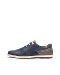 Men’s shoes made of navy leather with a gray leather panel, orange accents, white laces, and a rubber sole. Low-top design with stitching details.