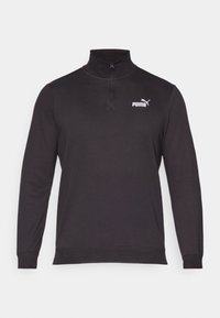 Sweatshirt noir en tricot, avec un col zippé moitié, des manches longues et un logo Puma blanc sur la poitrine gauche.
