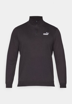 Zwarte pullover sweatshirt van gebreide stof, met een halvemouwen ritskraag, lange mouwen en een wit Puma-logo op de linkerkant van de borst.